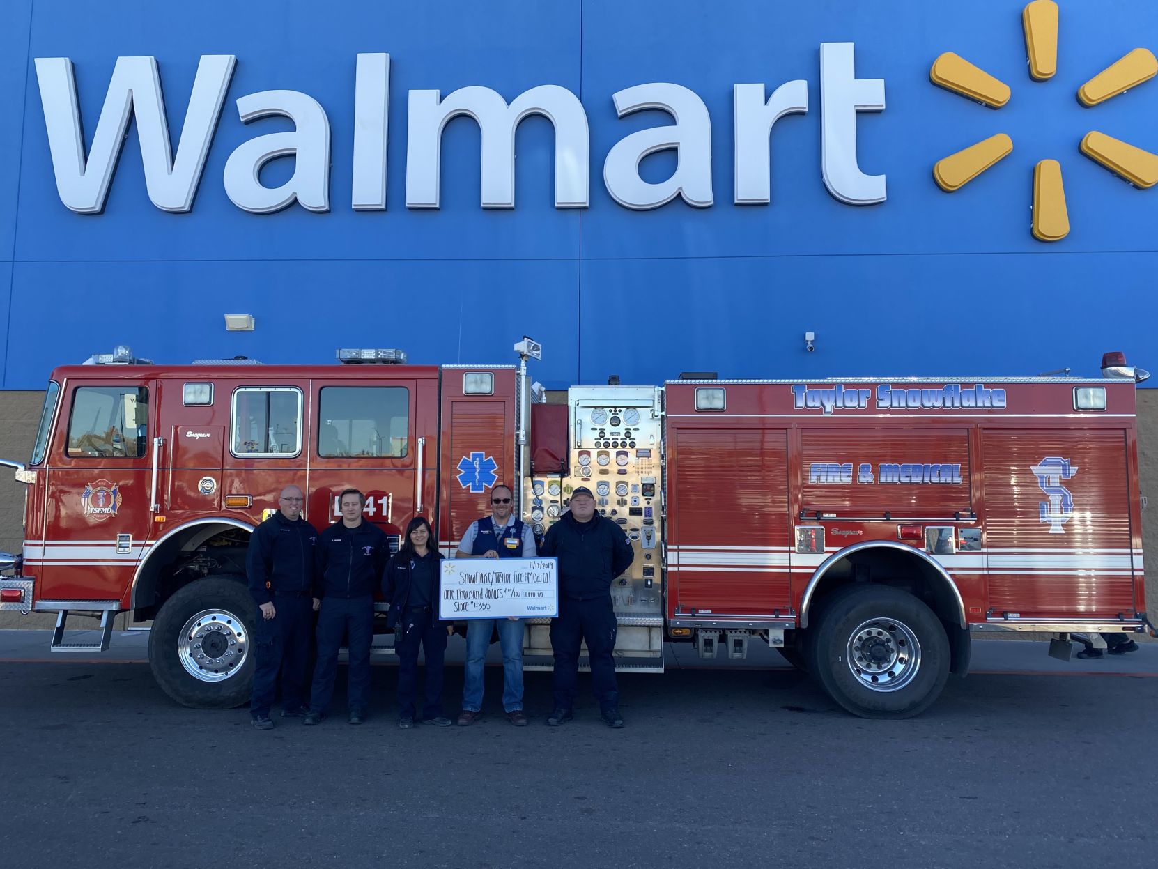 Walmart presents $1,000 to Taylor-Snowflake Fire and Medical